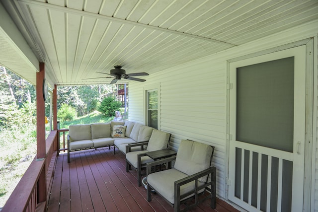 wooden deck with ceiling fan and an outdoor hangout area