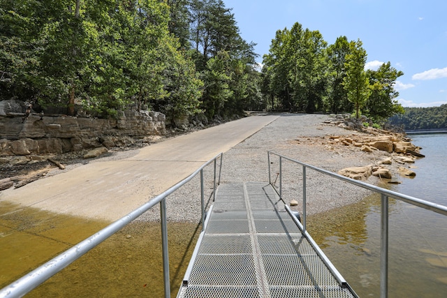 surrounding community featuring a water view