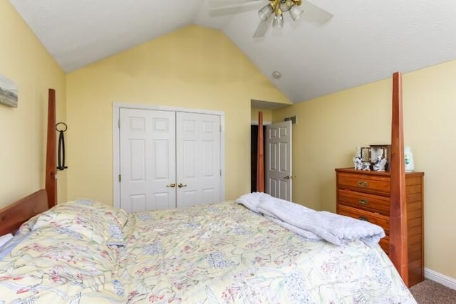 bedroom featuring vaulted ceiling, ceiling fan, a closet, and carpet flooring