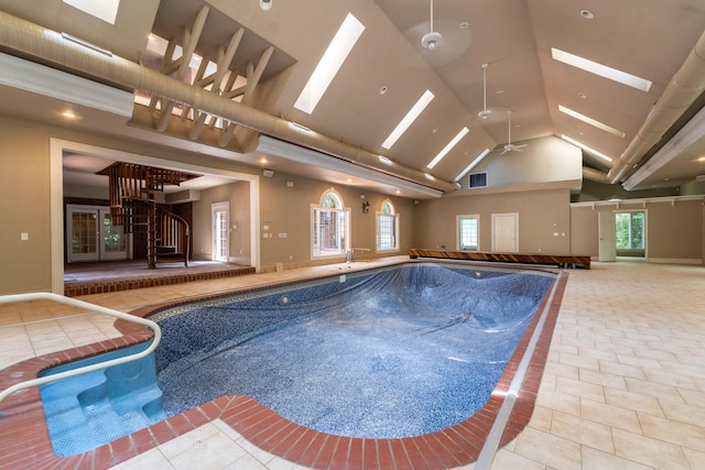 view of pool featuring a skylight and ceiling fan