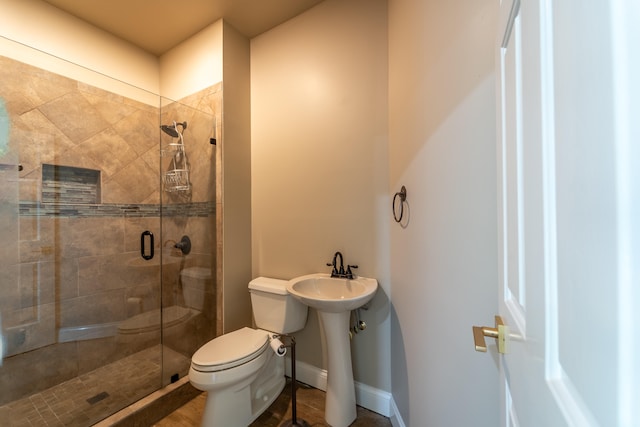 bathroom with walk in shower and toilet