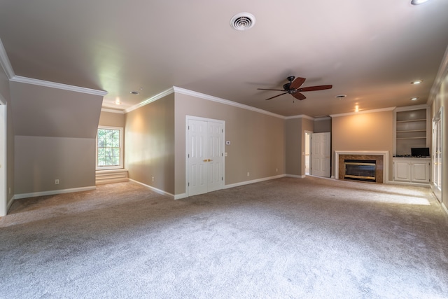 unfurnished living room featuring crown molding, ceiling fan, and light colored carpet