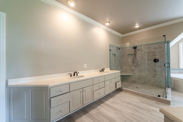 bathroom with walk in shower, vanity, crown molding, and hardwood / wood-style flooring