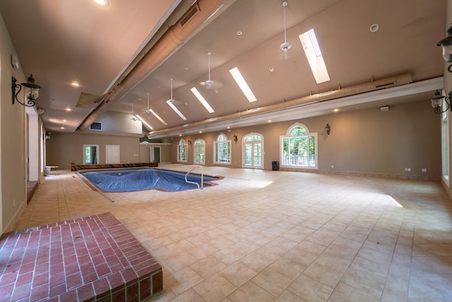 view of swimming pool featuring a skylight