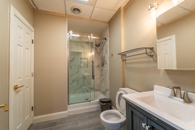 bathroom featuring vanity, toilet, and an enclosed shower