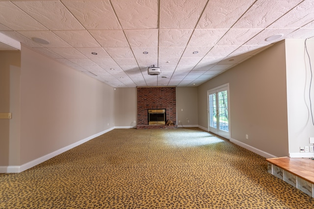 unfurnished living room with a brick fireplace and carpet floors