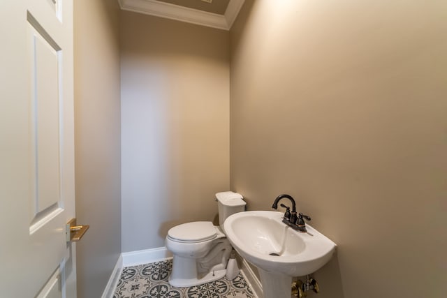 bathroom featuring ornamental molding, sink, tile patterned floors, and toilet