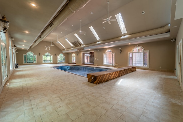 view of pool featuring a skylight and ceiling fan