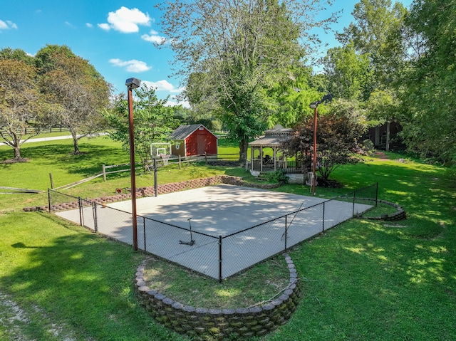 view of basketball court featuring a gazebo and a yard