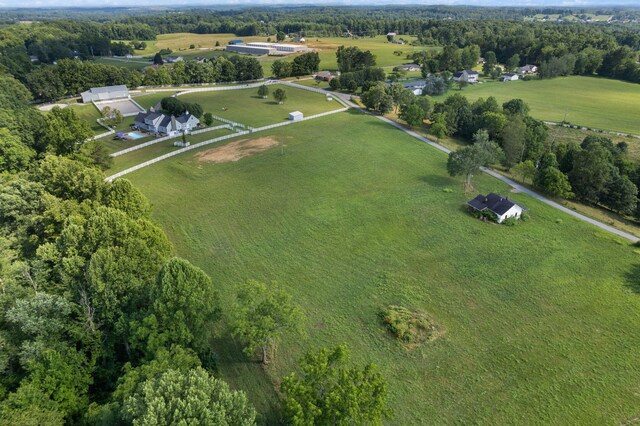 birds eye view of property with a rural view