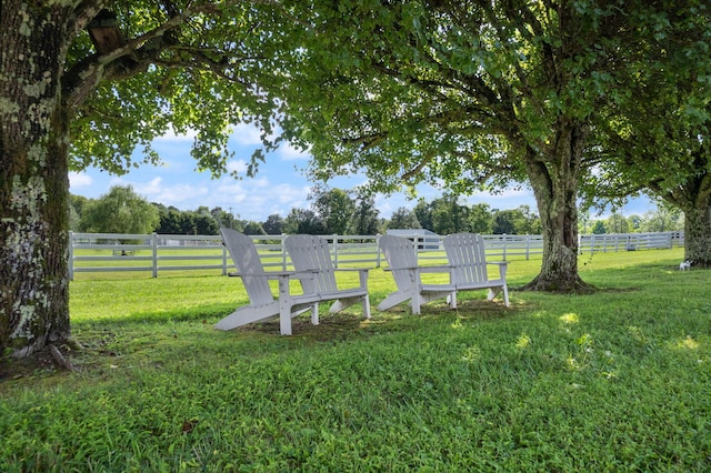 exterior space with a rural view and fence