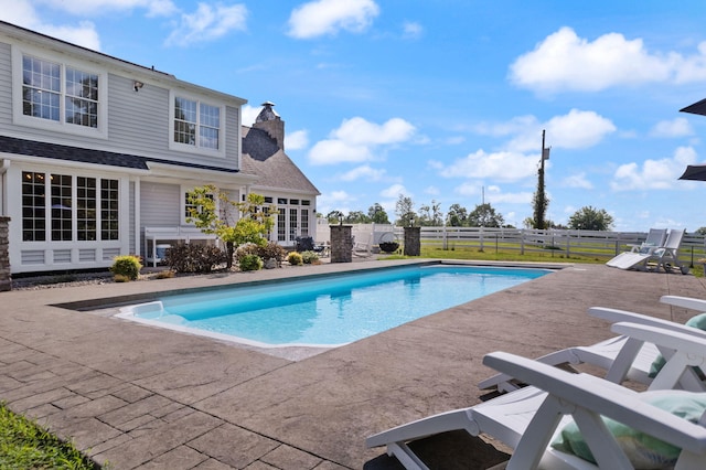 view of pool with fence, a fenced in pool, and a patio