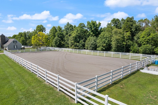 view of yard featuring a rural view and an enclosed area