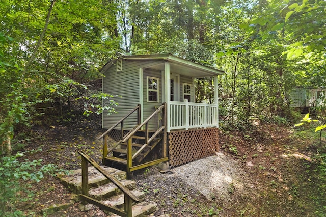 view of outdoor structure with covered porch