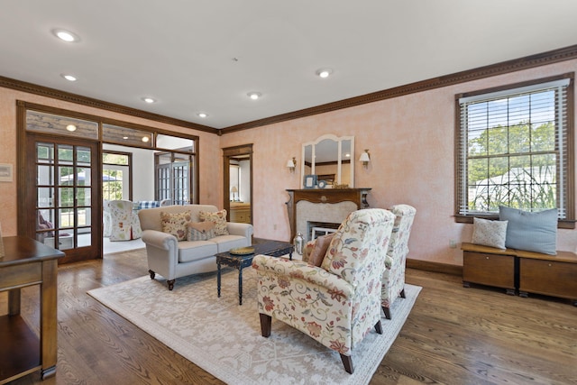 living room with dark hardwood / wood-style flooring and crown molding