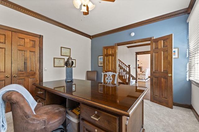 home office with ceiling fan, light colored carpet, and ornamental molding