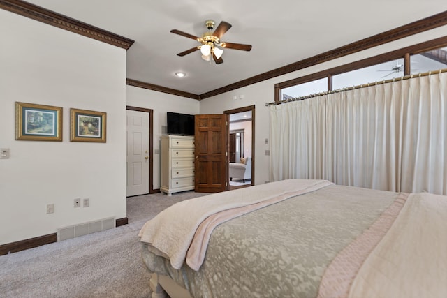 bedroom featuring carpet, visible vents, ornamental molding, ceiling fan, and baseboards