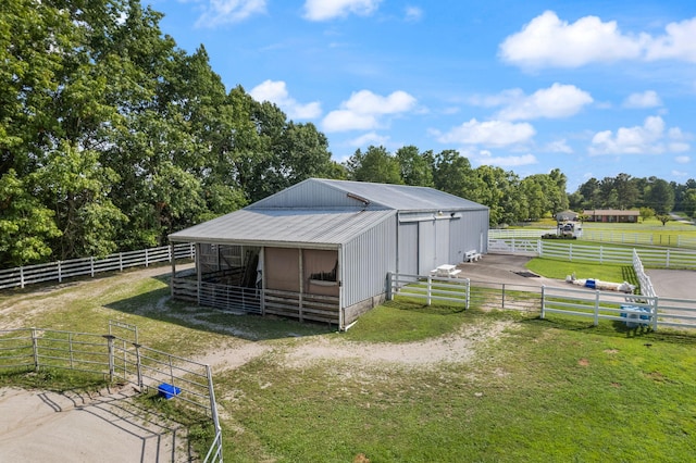 view of outbuilding featuring a rural view