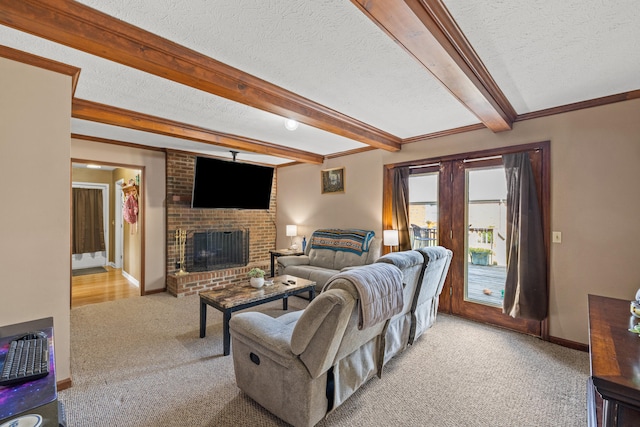 living room featuring a brick fireplace, beamed ceiling, light colored carpet, and a textured ceiling