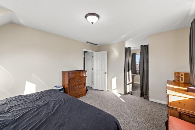 carpeted bedroom featuring lofted ceiling