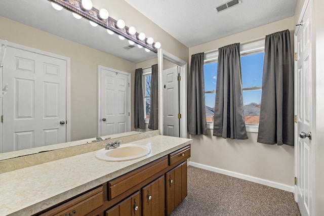 bathroom featuring vanity and a textured ceiling