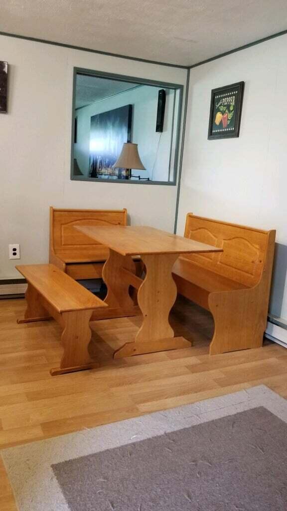 unfurnished dining area with a textured ceiling and hardwood / wood-style floors