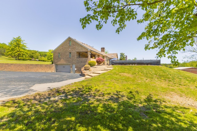 view of yard with a garage