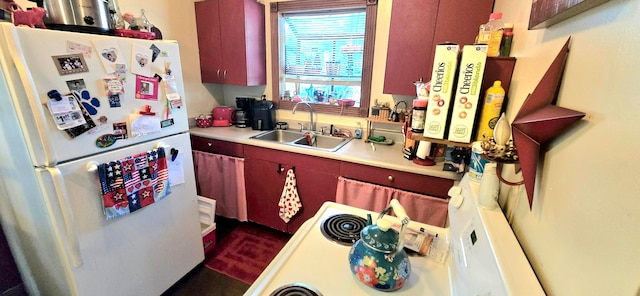 kitchen with white refrigerator and sink