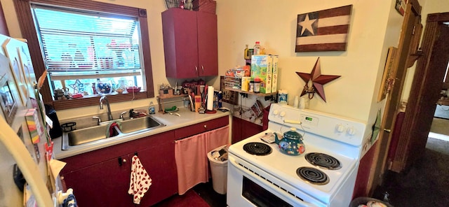 kitchen featuring white range with electric cooktop and sink