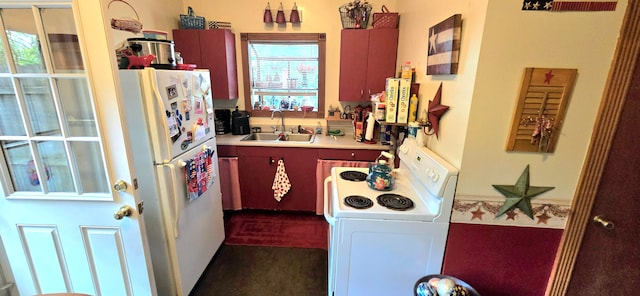 kitchen featuring white appliances and sink