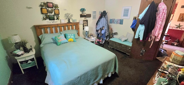 bedroom with dark colored carpet