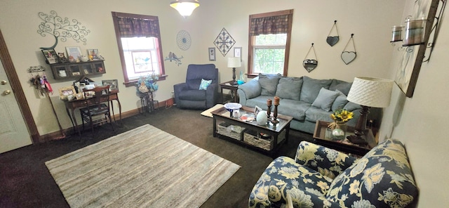 living room featuring dark carpet