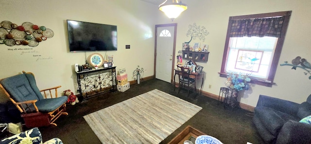 living room featuring dark carpet