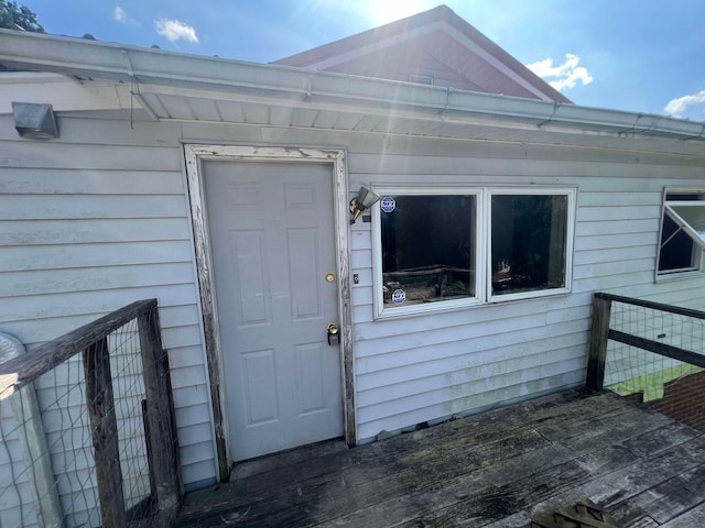 entrance to property with a deck