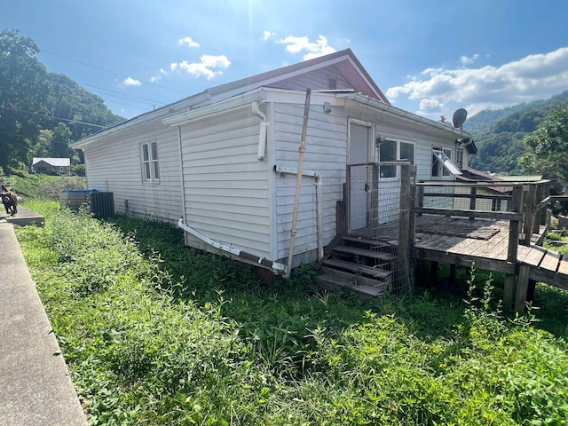 view of side of home featuring a deck