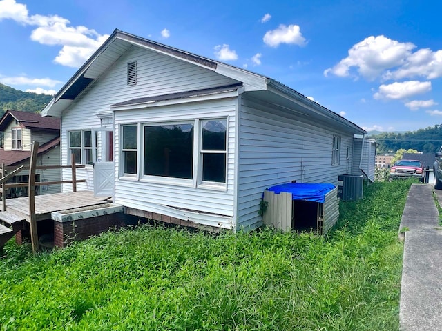 view of side of home with a deck