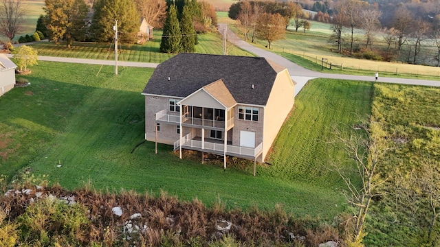 birds eye view of property with a rural view