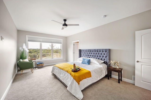 carpeted bedroom featuring visible vents, ceiling fan, and baseboards