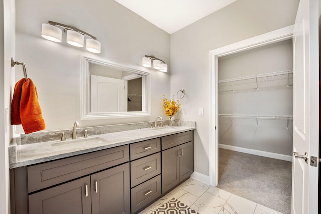 1830 Hunter Dr, Lancaster, KY 40444 - bathroom with double vanity, marble finish floors, baseboards, and a walk in closet