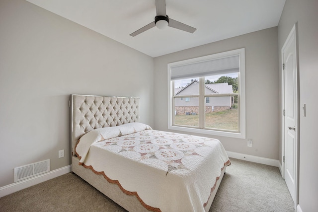 bedroom featuring ceiling fan and carpet