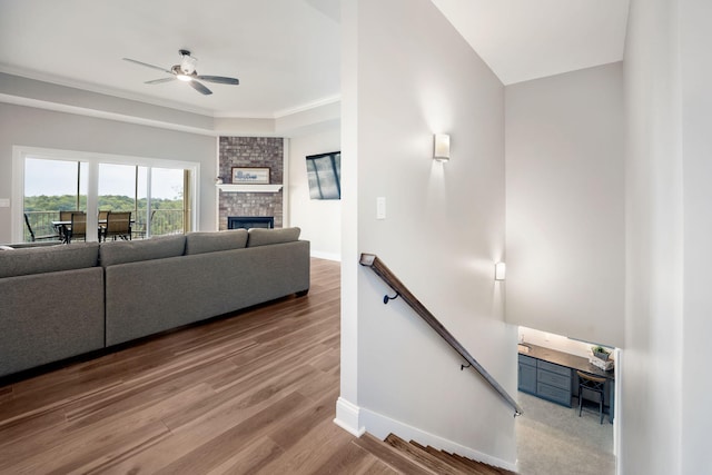 1830 Hunter Dr, Lancaster, KY 40444 - living room featuring ceiling fan, baseboards, wood finished floors, and a brick fireplace