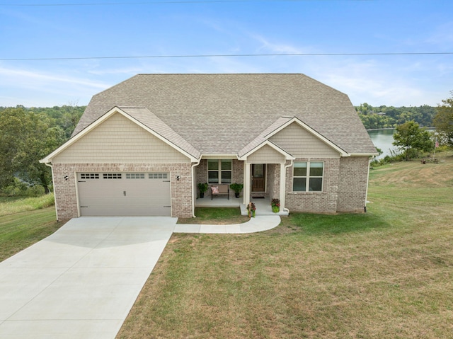 craftsman-style home with concrete driveway, roof with shingles, an attached garage, a front yard, and brick siding