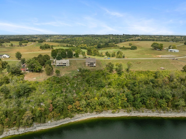 drone / aerial view with a water view and a rural view