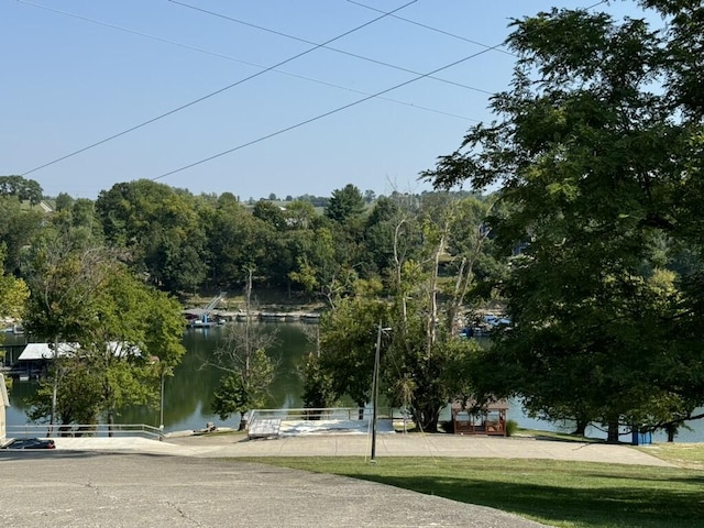 surrounding community featuring a water view