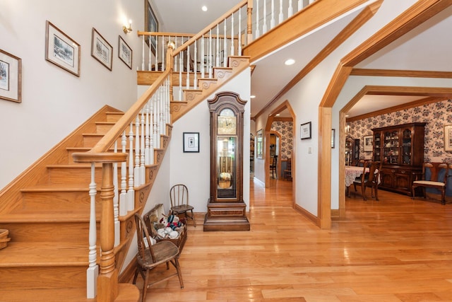 foyer featuring hardwood / wood-style flooring and ornamental molding