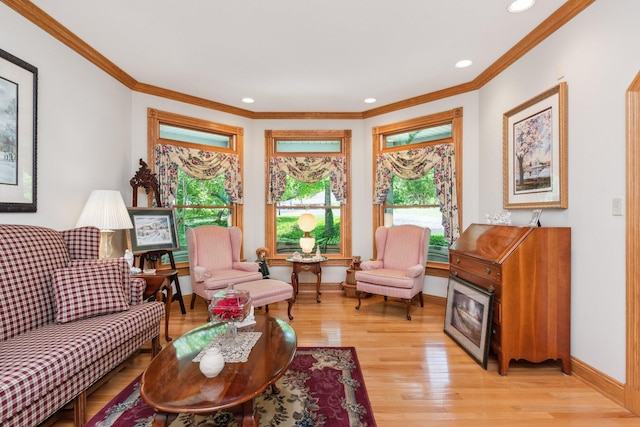 living room featuring ornamental molding and light wood-type flooring