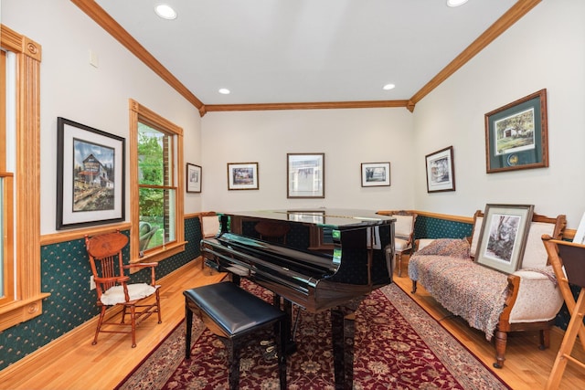 miscellaneous room featuring crown molding and hardwood / wood-style floors