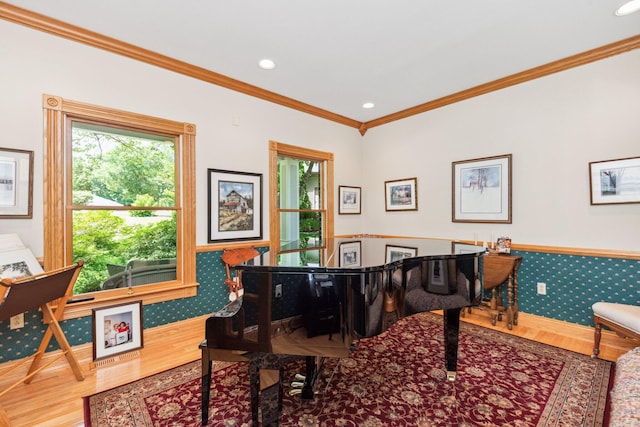 miscellaneous room with hardwood / wood-style floors and ornamental molding