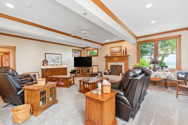 carpeted living room featuring ceiling fan and ornamental molding