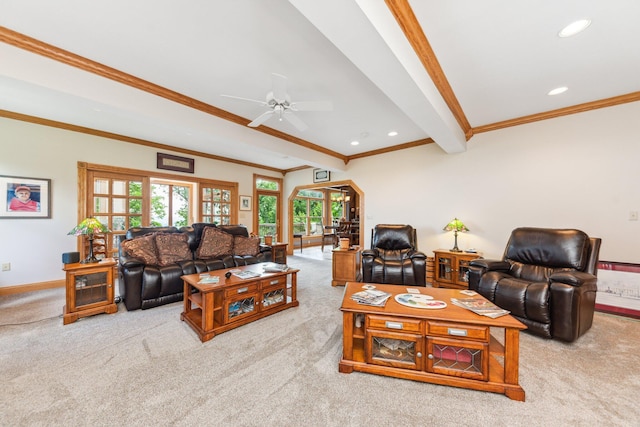 carpeted living room featuring ceiling fan, beamed ceiling, and ornamental molding